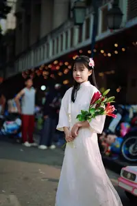 Graceful Vietnamese Girl in White Ao Dai Shines with Traditional Beauty in Old Quarter-0