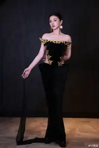 Radiant in Blue: A Woman's Elegant Charm Shines Bright in a Luxurious-8