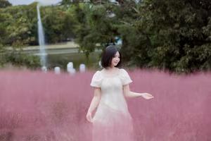 XVG No.33: Ethereal Beauty in White Dress Amidst Dreamy Pink Grass Field - A Serene Nature Escape-11