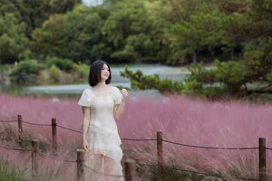XVG No.33: Ethereal Beauty in White Dress Amidst Dreamy Pink Grass Field - A Serene Nature Escape-10