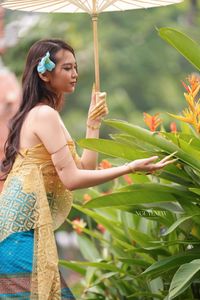 Traditional Vietnamese Beauty: Elegant Lady with Golden Lotus-8