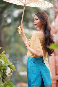 Traditional Vietnamese Beauty: Elegant Lady with Golden Lotus-3