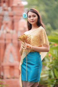 Traditional Vietnamese Beauty: Elegant Lady with Golden Lotus-7