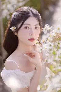 Serene Beauty: Young Woman in White Flower Field, Embracing Tranquility Under Gentle Sunlight-3