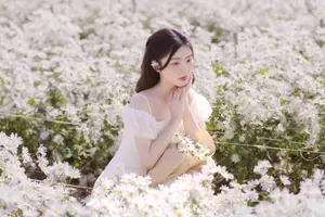 Serene Beauty: Young Woman in White Flower Field, Embracing Tranquility Under Gentle Sunlight-9