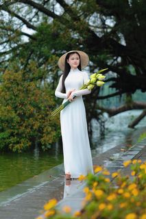 Vietnamese Ao Dai Beauty: Elegant Young Woman by Hoan Kiem Lake, Traditional Charm.-2