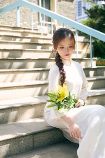 Youthful Vietnamese Girl in Pure White Silk Ao Dai with Yellow Lilies-4
