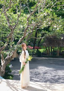 Youthful Vietnamese Girl in Pure White Silk Ao Dai with Yellow Lilies-8