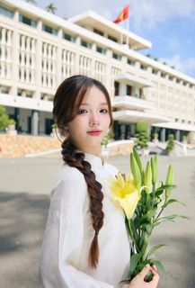 Youthful Vietnamese Girl in Pure White Silk Ao Dai with Yellow Lilies-7