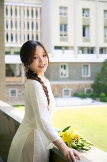 Youthful Vietnamese Girl in Pure White Silk Ao Dai with Yellow Lilies-0
