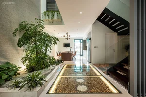 Minimalist Sanctuary: Elevating Modern Living with Floor-to-Ceiling Glass Walls and Lush Indoor Greenery-13