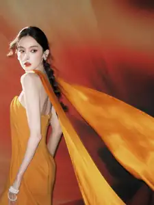 Captivating Beauty: Goddess in a Vibrant Orange Gown, Exuding Elegant Allure.-3
