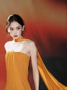 Captivating Beauty: Goddess in a Vibrant Orange Gown, Exuding Elegant Allure.-0