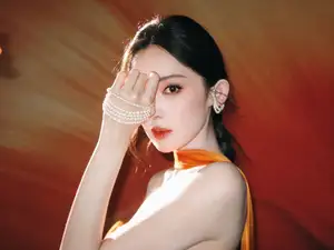 Captivating Beauty: Goddess in a Vibrant Orange Gown, Exuding Elegant Allure.-2