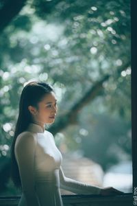 Graceful Vietnamese Girl in White Ao Dai by Window, Celebrating Traditional Beauty-8