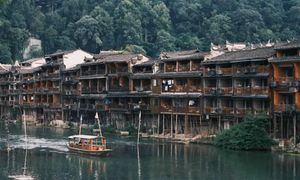Discover Fenghuang Ancient Town: Serene boat ride, historic riverside charm.-7
