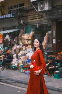 Vietnamese Girl's Bright Smile with Lucky Plush Horses in a Traditional Market.-4