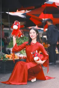 Vietnamese Girl's Bright Smile with Lucky Plush Horses in a Traditional Market.-0