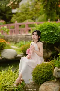 Graceful Young Woman in a Dreamy Garden: A Serene and Elegant Moment 1000025211-2