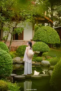 Graceful Young Woman in a Dreamy Garden: A Serene and Elegant Moment 1000025211-6