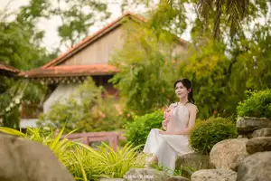 Graceful Young Woman in a Dreamy Garden: A Serene and Elegant Moment 1000025211-7