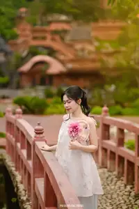 Graceful Young Woman in a Dreamy Garden: A Serene and Elegant Moment 1000025211-1