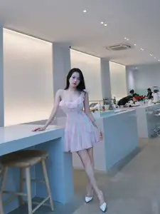 Gentle Charm: Beautiful Girl in Pink Floral Dress, Captivating Elegant Style.-2