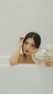 Ethereal Girl in Bathtub with White Flower: Serene Beauty & Relaxing Moment 1000018799.jpg-1
