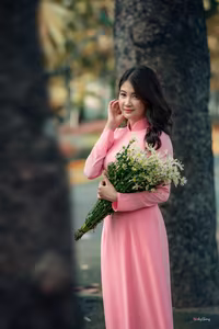 VGU No.20: Graceful Pink Ao Dai Muse Capturing Elegant Vietnamese Beauty Amidst Romantic Autumn Hues-1