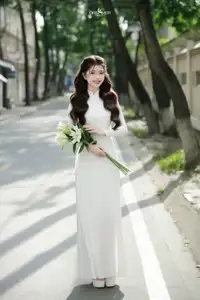 Vietnamese Schoolgirl Gracefully in Pure White Ao Dai Traditional Conical Hat and Lilies-11