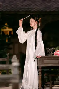 Enchanting Vietnamese Beauty A Girl with Long Braids in Traditional Attire on a Magical Night-2
