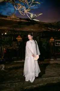 Enchanting Vietnamese Beauty A Girl with Long Braids in Traditional Attire on a Magical Night-3