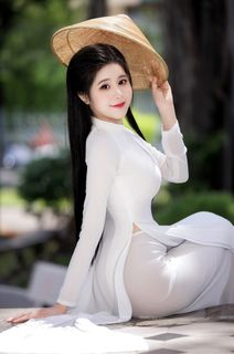 Vietnamese Beauty: Elegant Traditional White Ao Dai Woman with Conical Hat-1