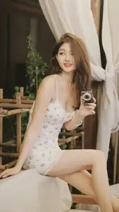 Captivating East Asian Beauty in Floral Slip Dress with Vintage Camera-4