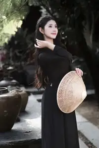 Timeless Beauty: Graceful Vietnamese Lady in Black Ao Dai Captivates with Asian Elegance.-4