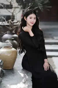 Timeless Beauty: Graceful Vietnamese Lady in Black Ao Dai Captivates with Asian Elegance.-0