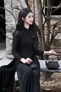 Timeless Beauty: Graceful Vietnamese Lady in Black Ao Dai Captivates with Asian Elegance.-7