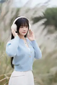 Explore Serene Beauty: Long-Haired Girl Immersed in Music Amidst Pampas Grass-6