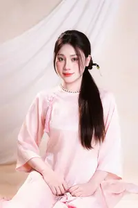 Vietnamese Beauty: Graceful in Traditional Pink Ao Dai and Conical Hat-5