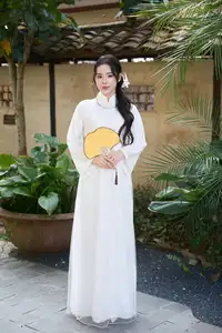 Elegant White Ao Dai: Pure Beauty of Vietnamese Woman with Pristine Orchids.-9