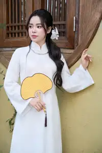 Elegant White Ao Dai: Pure Beauty of Vietnamese Woman with Pristine Orchids.-16