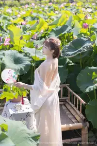 Discover Lu Xuan Xuan's Graceful Beauty in a White Dress Amidst a Serene Lotus Pond - XiuRen No.10630-15