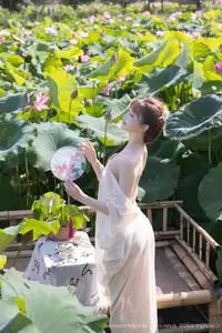 Discover Lu Xuan Xuan's Graceful Beauty in a White Dress Amidst a Serene Lotus Pond - XiuRen No.10630-34
