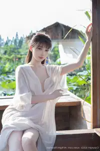 Discover Lu Xuan Xuan's Graceful Beauty in a White Dress Amidst a Serene Lotus Pond - XiuRen No.10630-35