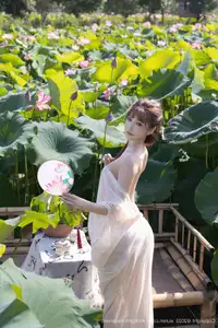 Discover Lu Xuan Xuan's Graceful Beauty in a White Dress Amidst a Serene Lotus Pond - XiuRen No.10630-45