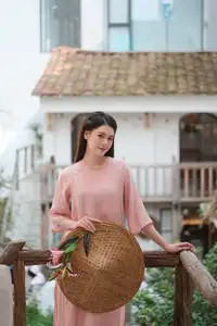Discover Serene Vietnamese Beauty: Elegant Woman in Pink Linen Dress Amidst Floral Charm-7