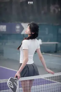 Pensive Break on Court: Young Tennis Player Recharges Energy After Intense Training Session-1