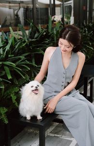 Elegant Woman and Adorable Pomeranian: Chic Fashion & Pet Joy.-9