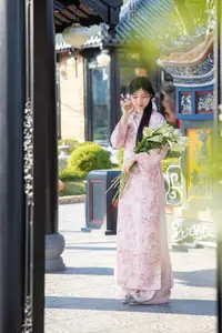 Graceful Asian Lady in Pink Ao Dai with Pristine White Lilies in Traditional Setting-7