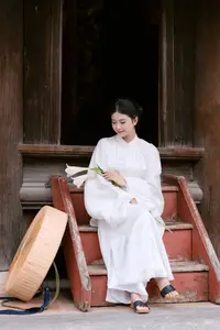 Graceful Vietnamese Beauty: A Serene Woman in White with a Lily-0